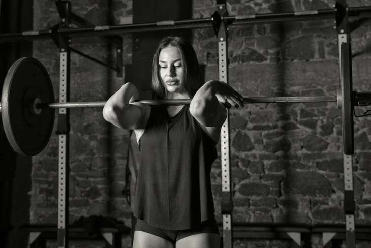 girl with squat rack